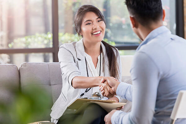 patient smiling at healthcare worker